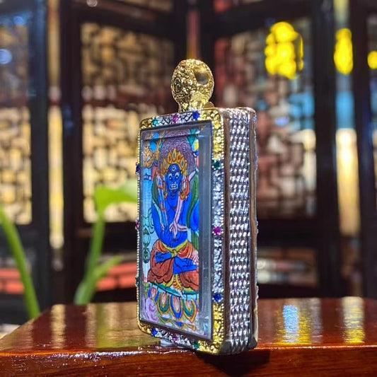 Side view of the Acala Vidyaraja Thangka Gau Pendant, showcasing the gold-plated copper structure and detailed artwork.