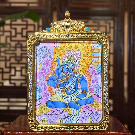 Hand-painted Acala Vidyaraja in a grounded and stabilizing wrathful form, seated in balanced posture with upright wisdom sword, depicted on a double-sided Tibetan thangka Gawu pendant