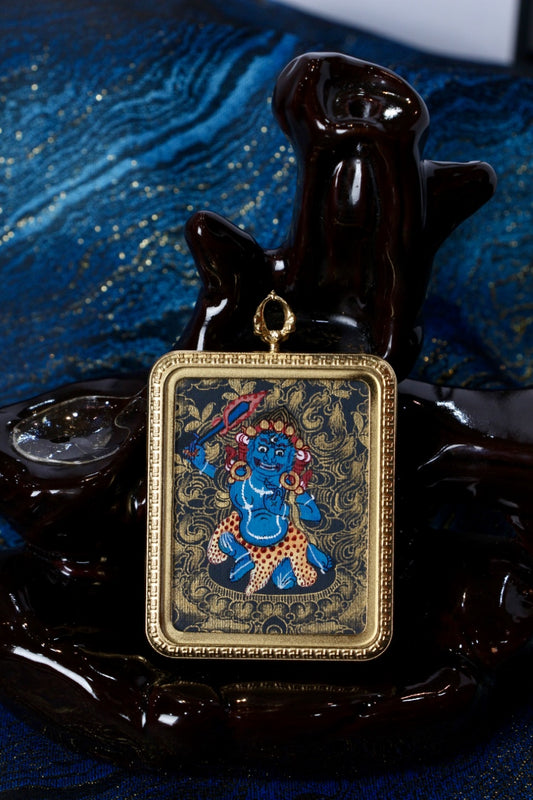 Front view of Acalanatha (Fudo Myo-o) mini thangka pendant in Nepalese black-gold style, hand-painted artwork set in a gold-tone titanium steel protective case