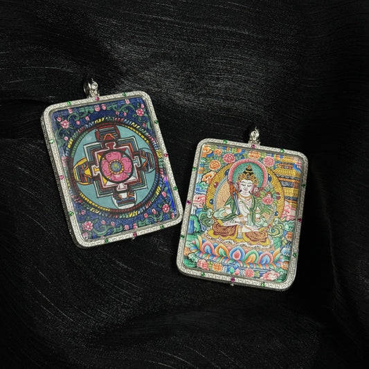 Front and back view of Akashagarbha Bodhisattva mini thangka pendant showing the hand-painted bodhisattva on the front and a colorful Tibetan mandala on the reverse, mounted in a square 925 silver pendant frame with gemstone accents.