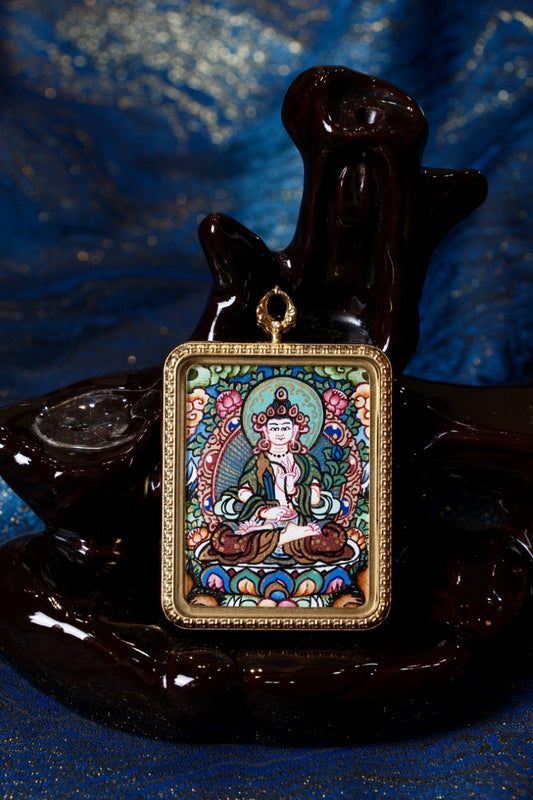 Close-up of Akashagarbha Bodhisattva hand-painted mini thangka pendant in gold-tone titanium-steel case