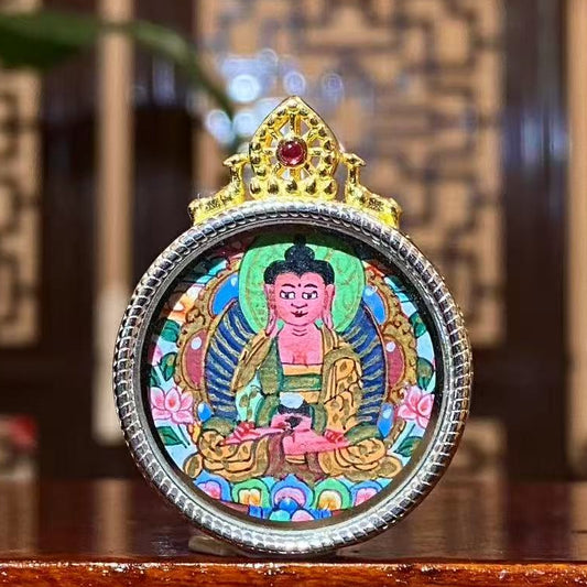 Front view of hand-painted Amitabha Buddha mini thangka in a round S925 silver Gau pendant, featuring a seated Buddha with halo, lotus motifs, and vivid traditional colors