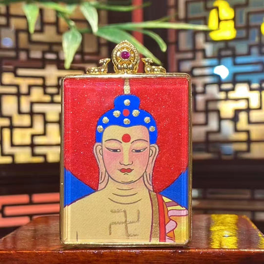 Front view of hand-painted Amitabha Buddha thangka in a gold-plated copper Gau pendant, showing a seated Buddha with lotus throne, halo, and detailed traditional iconography