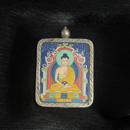 Front view of Amitabha Buddha mini Thangka pendant, hand-painted with mineral pigments and set in Dunhuang Nine-Color Deer silver case