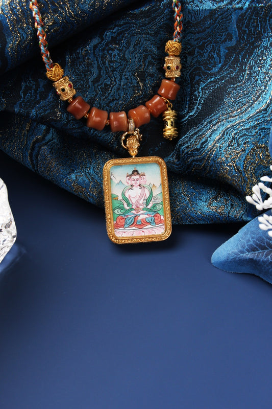 Close-up view of Vairocana Buddha mini thangka pendant highlighting the rectangular metal frame texture, painted lotus seat colors, and the bead-and-knot necklace structure above