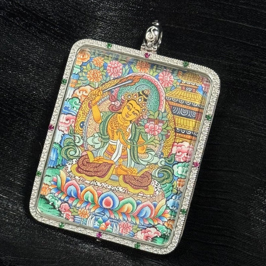 Close-up of the hand-painted Manjushri Wisdom Buddha pendant featuring Mandala artwork, surrounded by 925 silver plating, offering protection and wisdom for Rabbit and Gemini zodiac.