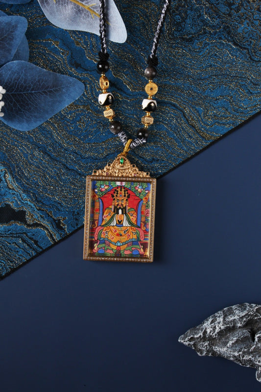 Front view of Dragon Fifth Lord Wu Ye wealth deity thangka pendant from Nepal, handmade Buddhist amulet symbolizing prosperity, protection, and righteous wealth