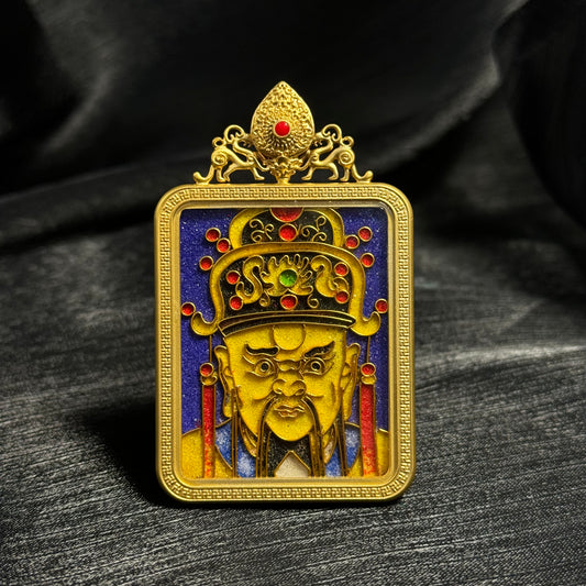 Handcrafted cloisonné enamel Dragon King Wuye mini thangka pendant with 24K gold-plated copper frame, detailed golden deity face, ornate crown with red enamel accents, and deep blue enamel background.