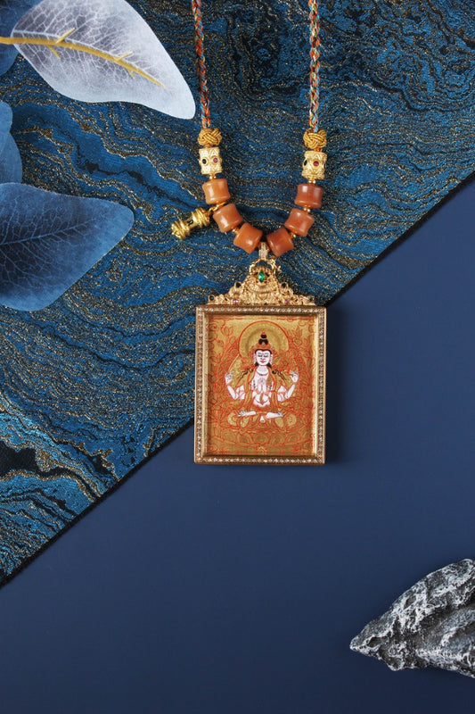Four-Armed Avalokiteshvara thangka pendant featuring a hand-painted deity on gold ground, set in a jeweled titanium steel frame with braided cord and traditional beads, Rebgong Tibetan art.