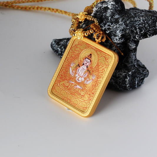 Angled view of the Four-Armed Avalokiteshvara mini thangka pendant highlighting the thickness of the copper case, gold-ground painting surface, and layered mineral pigment texture.