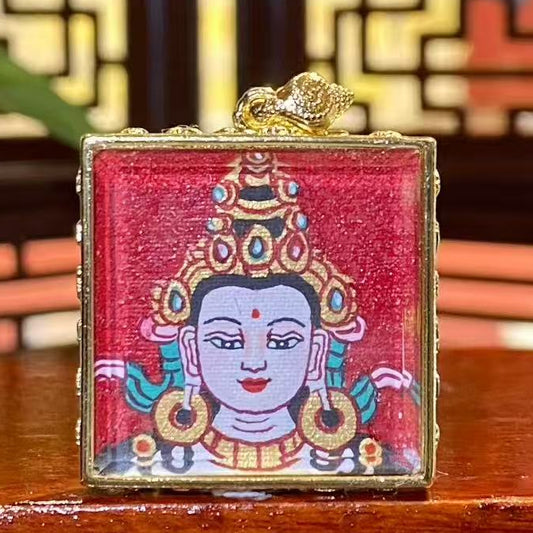 Hand-painted Four-Armed Avalokiteshvara mini thangka pendant in a gilded copper Ghau box, front view