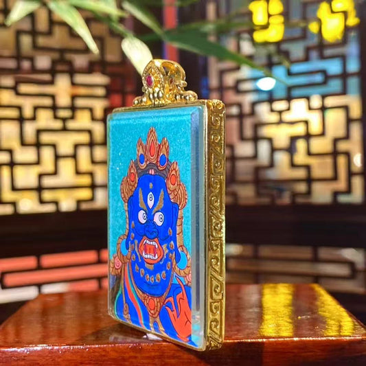 Side view of a compact Acala Vidyaraja Tibetan amulet Gawu pendant crafted in gilded copper, suitable for daily wear and travel protection