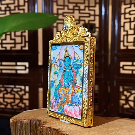 Side view of a Green Tara Gau Thangka pendant showing the thickness and craftsmanship of the gold-plated copper gau box with embedded decorative details