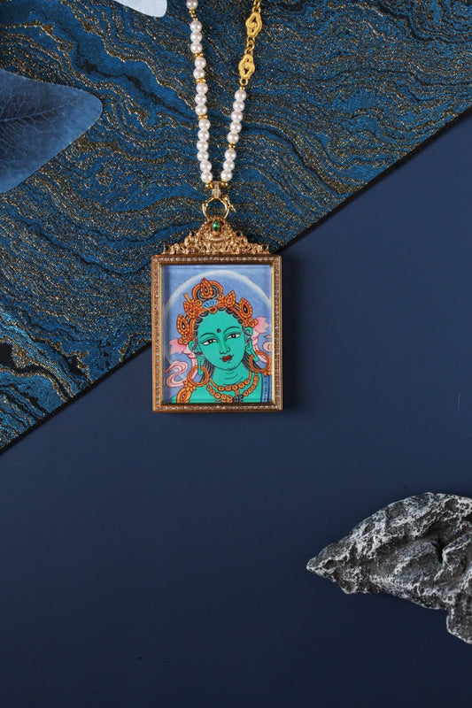 Green Tara head thangka pendant from Nepal raw mineral series, hand-painted Buddhist deity portrait in double-sided titanium steel frame, symbol of protection, wisdom, and compassion