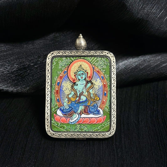 Front view of Green Tara mini thangka pendant highlighting traditional Tibetan thangka painting and ornate silver pendant frame