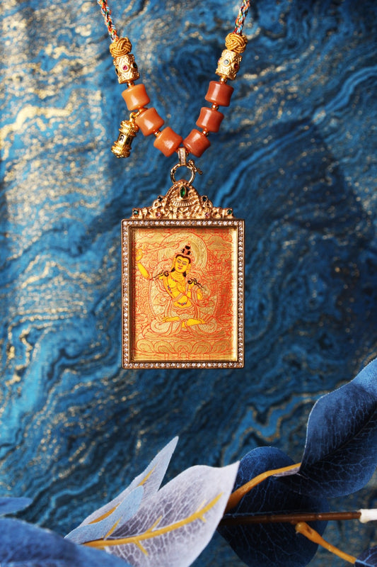 Full display of hand-painted Manjushri Bodhisattva mini thangka pendant in Rebgong gold thangka tradition, highlighting balanced iconographic proportions, mineral pigment coloration, and double-sided titanium steel casing