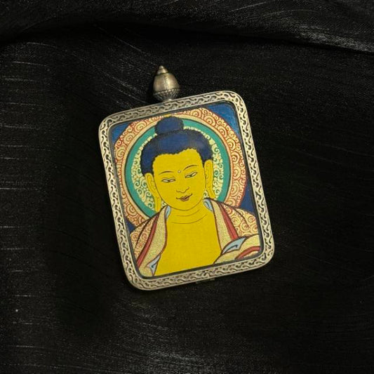Front view of Shakyamuni Buddha mini thangka pendant featuring traditional Buddhist iconography painted with mineral pigments