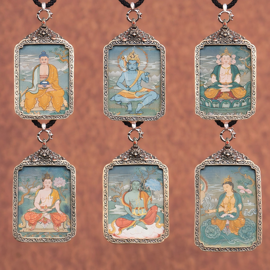 A collection of 9 hand-painted Tibetan Thangka pendants featuring different deities in Karma Gadri style, displayed in an elegant 3x3 grid. Each pendant is framed with intricate silver filigree, showcasing vibrant colors and spiritual symbolism.