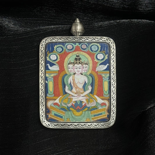 Hand-painted 4×5 cm Vairocana Buddha mini Thangka pendant displayed against dark fabric background