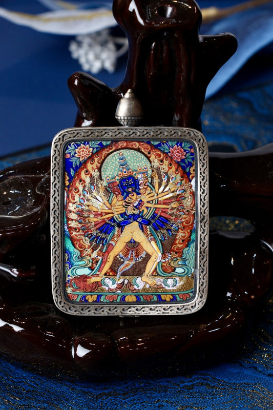Rebgong-style Kalachakra Vajra thangka pendant shown hanging, featuring intricate multi-armed deity imagery, vivid mineral pigments, and traditional Tibetan wrathful iconography.