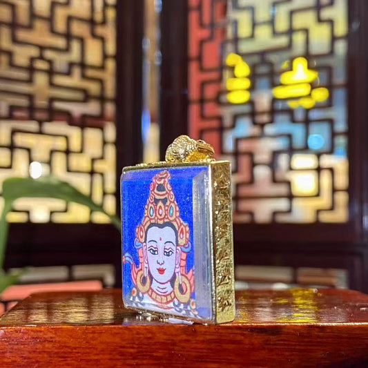 Detail view of a Mahāsthāmaprāpta mini thangka Gawu pendant, hand-painted Buddhist art in a gold-plated copper case, suitable for daily wear and meditation
