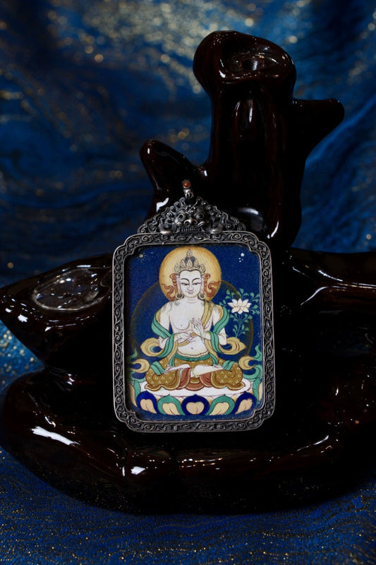 Front view of a Mahasthamaprapta Bodhisattva mini thangka pendant, hand-painted with mineral pigments and set in a vintage silver case.