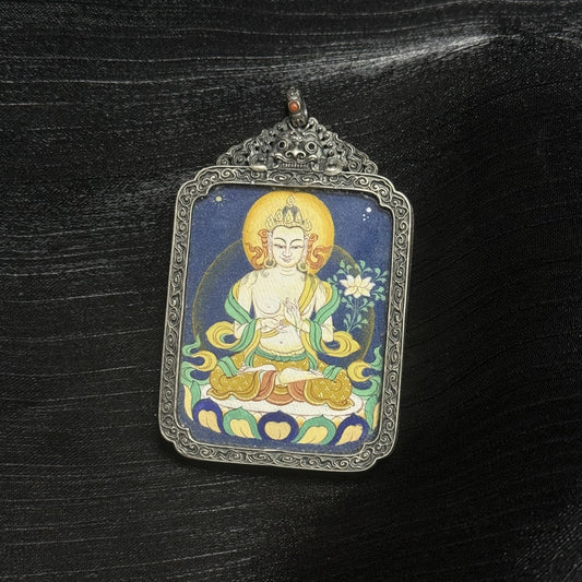 Close-up detail of Mahasthamaprapta Bodhisattva thangka painting showing serene facial expression, hand gesture, halo, and mineral pigment layering.