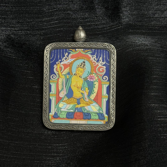 Hand-painted Manjushri Bodhisattva mini thangka in Qigang painting style, featuring wisdom sword and lotus iconography inside an engraved Dunhuang Nine-Color Deer silver gawu pendant frame