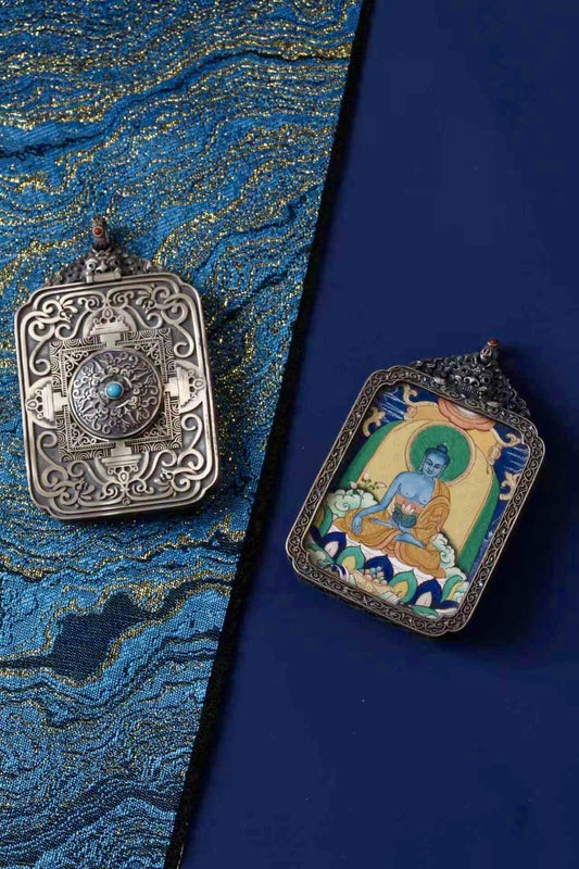 Front and back view of Medicine Buddha thangka gawu pendant, showing engraved vintage silver case and hand-painted image