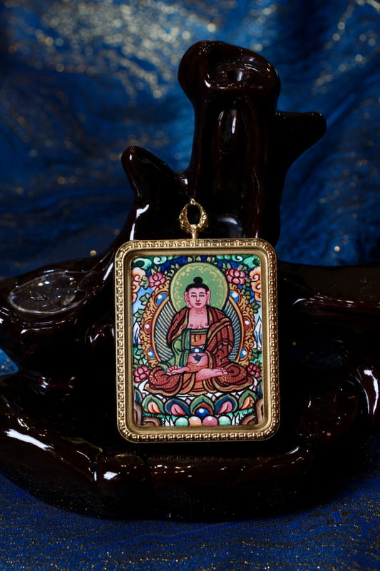 Hand-painted Nepal Thangka pendant featuring Amitabha Buddha, seated on a lotus throne, gold-tone frame, symbol of infinite light, compassion, and rebirth in the Pure Land