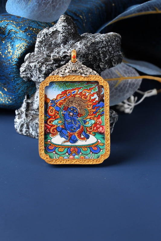 Close-up front view of Rebgong high-grade Acala Thangka pendant, depicting Fudo Myo-o with flames and sword, painted with natural mineral pigments