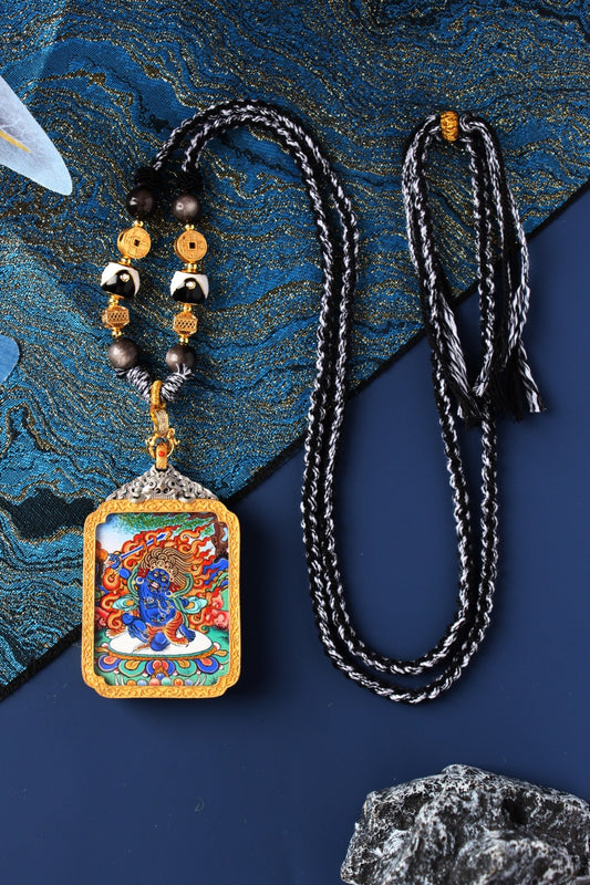 Hand-painted Rebgong Acala Thangka pendant featuring Fudo Myo-o with traditional braided cord, mineral pigments, and electroplated silver frame