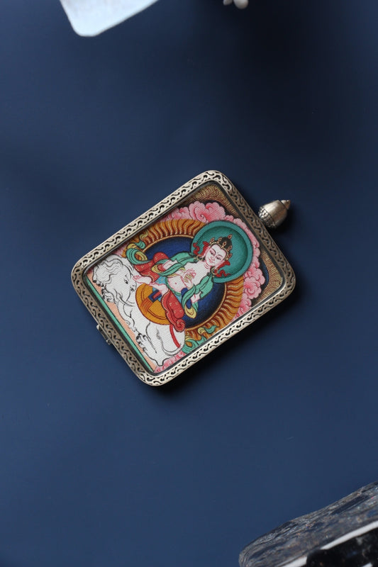 Front view of Samantabhadra Bodhisattva mini thangka pendant, hand-painted with natural mineral pigments and set in a Tibetan silver gawu-style case