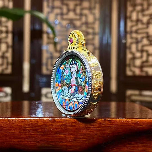 Side view of Samantabhadra Bodhisattva mini thangka pendant showing the round S925 sterling silver Tibetan Gawu craftsmanship