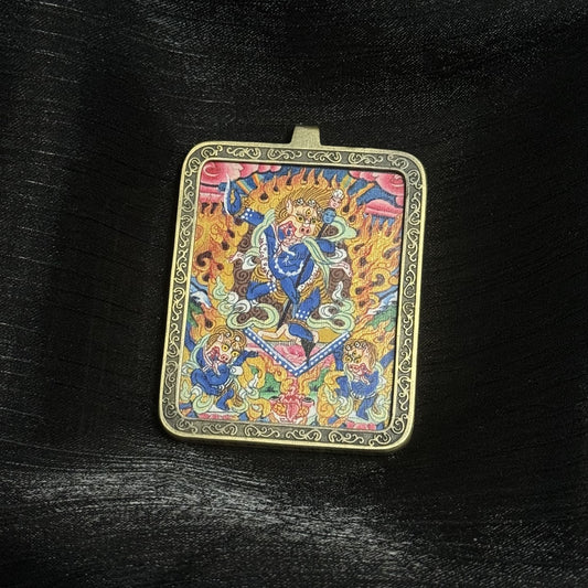 Hand-painted Simhamukha Dakini mini thangka pendant showing lion-faced wrathful dakini surrounded by flames, detailed mineral pigment painting set in a copper protective frame