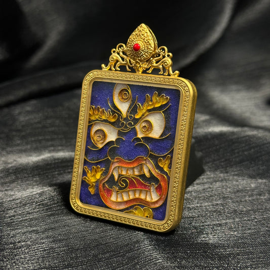 Angled close-up of Six-Armed Mahakala cloisonné enamel pendant highlighting layered enamel colors, gold wire cloisonné lines, and protective copper frame