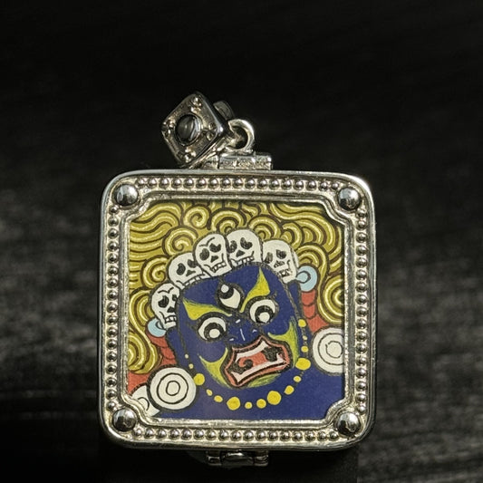 Front view of Six-Armed Mahakala mini thangka pendant featuring hand-painted Tibetan protector deity artwork with natural mineral pigments in a silver gawu pendant frame