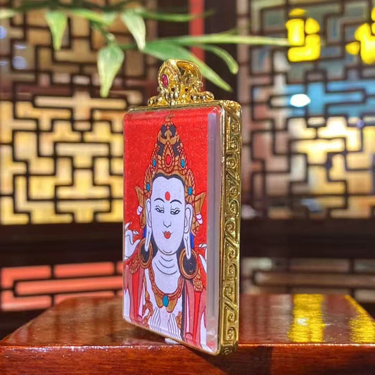 Back view of small Four-Armed Avalokiteshvara thangka pendant showing the gilded copper Ghau box details