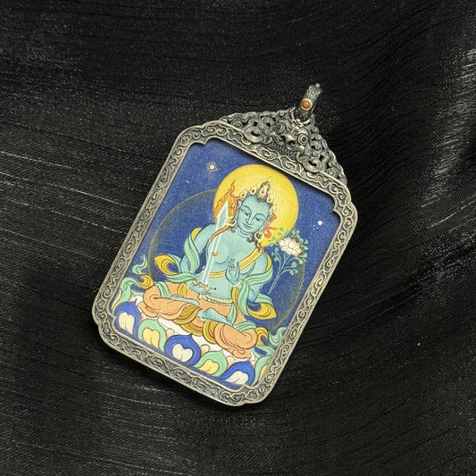 Front view of Akasagarbha Bodhisattva mini thangka pendant showing blue-toned mineral pigments, golden halo, lotus seat, and traditional Tibetan composition.