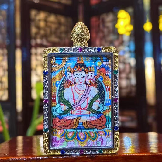 Hand-painted Vairocana Buddha mini thangka pendant in a gold-plated copper Gawu box, front view showing the Great Sun Buddha, 25×35mm