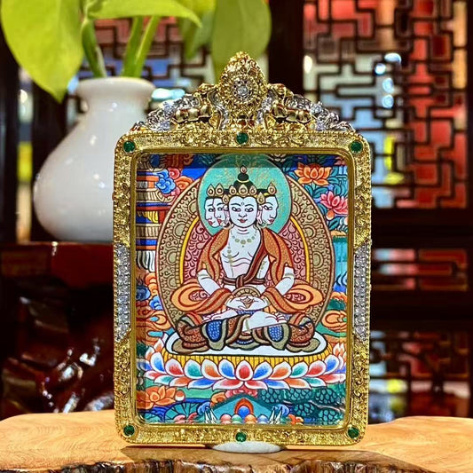 Hand-painted front view of a Vairocana Buddha mini thangka pendant set in a gold-plated copper Gawu box, single-sided painting, 56×45mm