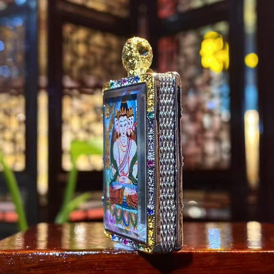 Close-up detail of a hand-painted Vairocana Buddha mini thangka pendant in a gold-plated Tibetan Gawu box, 25×35mm