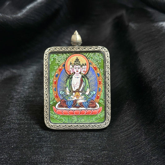 Front view of Vairocana Buddha mini thangka pendant featuring traditional Rebgong Tibetan thangka painting with mineral pigments.