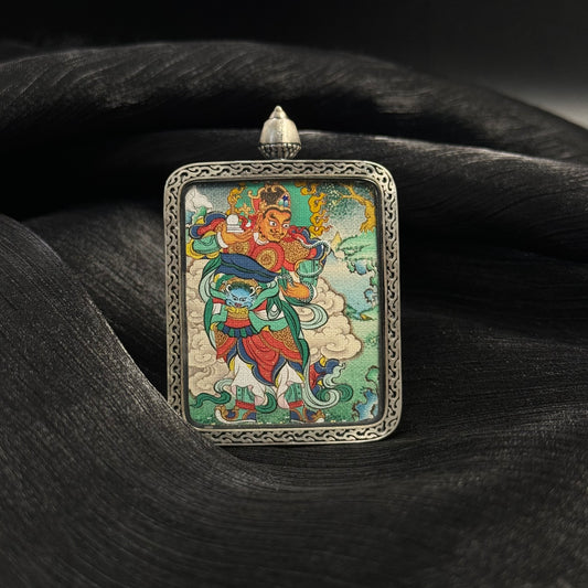 Front view of Virupaksha Western Guardian King mini thangka pendant hand-painted with mineral pigments in a 925 silver Nine-Colored Deer relief case