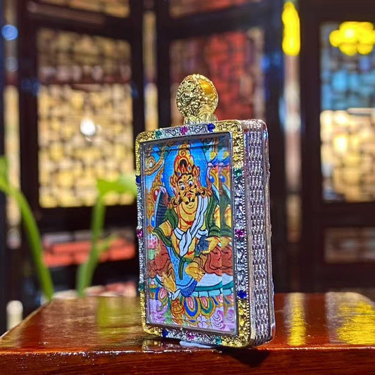 Side view of Tibetan Yellow Jambhala Gawu pendant showing gold-plated copper amulet box craftsmanship