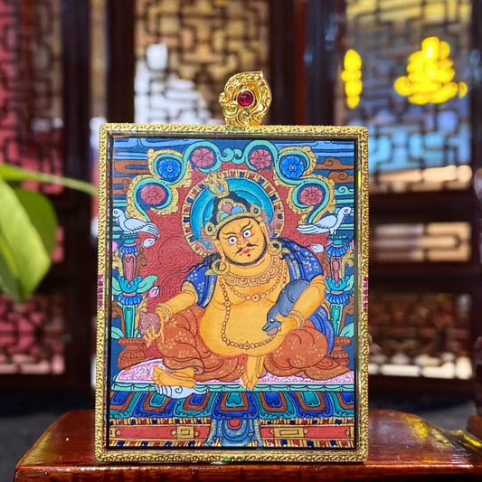 Front view of Yellow Jambhala Tibetan thangka pendant, double-sided hand-painted with 18K gold in Rebgong style, symbolizing wealth growth, protection, and obstacle removal