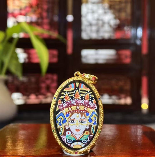 Front view of a double-sided Tibetan Ghau Thangka pendant featuring Zaki Lham, hand-painted in 18K gold using Rebgong Thangka techniques
