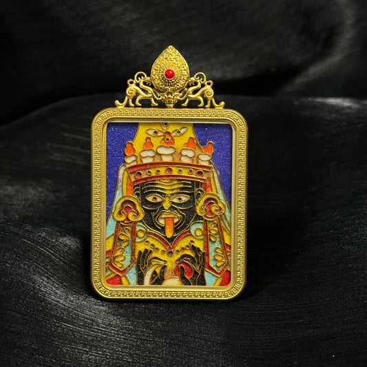 Front view of Zaki Lhamo mini thangka pendant featuring cloisonné enamel deity artwork, gold-plated copper frame, and traditional Tibetan decorative crown detail.
