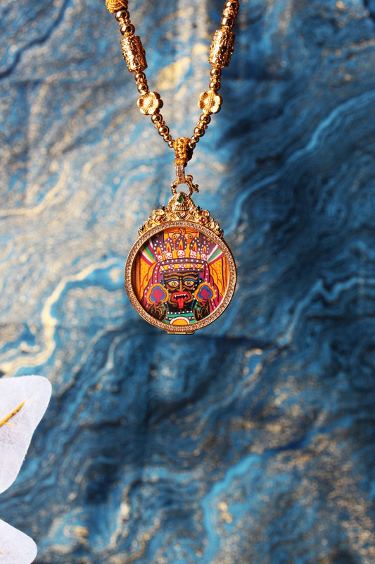 Hand-painted Zaki Lhamo mini thangka pendant in round jewelry-grade titanium steel case, vivid mineral pigment colors, Nepal Series devotional artwork