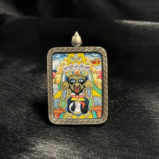 Front view of Zaki Lhamo Potala Palace form mini thangka pendant, hand-painted with mineral pigments and gold powder in the Rebgong Tibetan thangka tradition, set inside a decorative silver pendant frame.